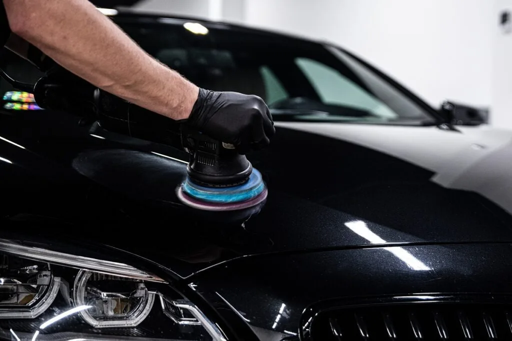 Technician performing car paint correction